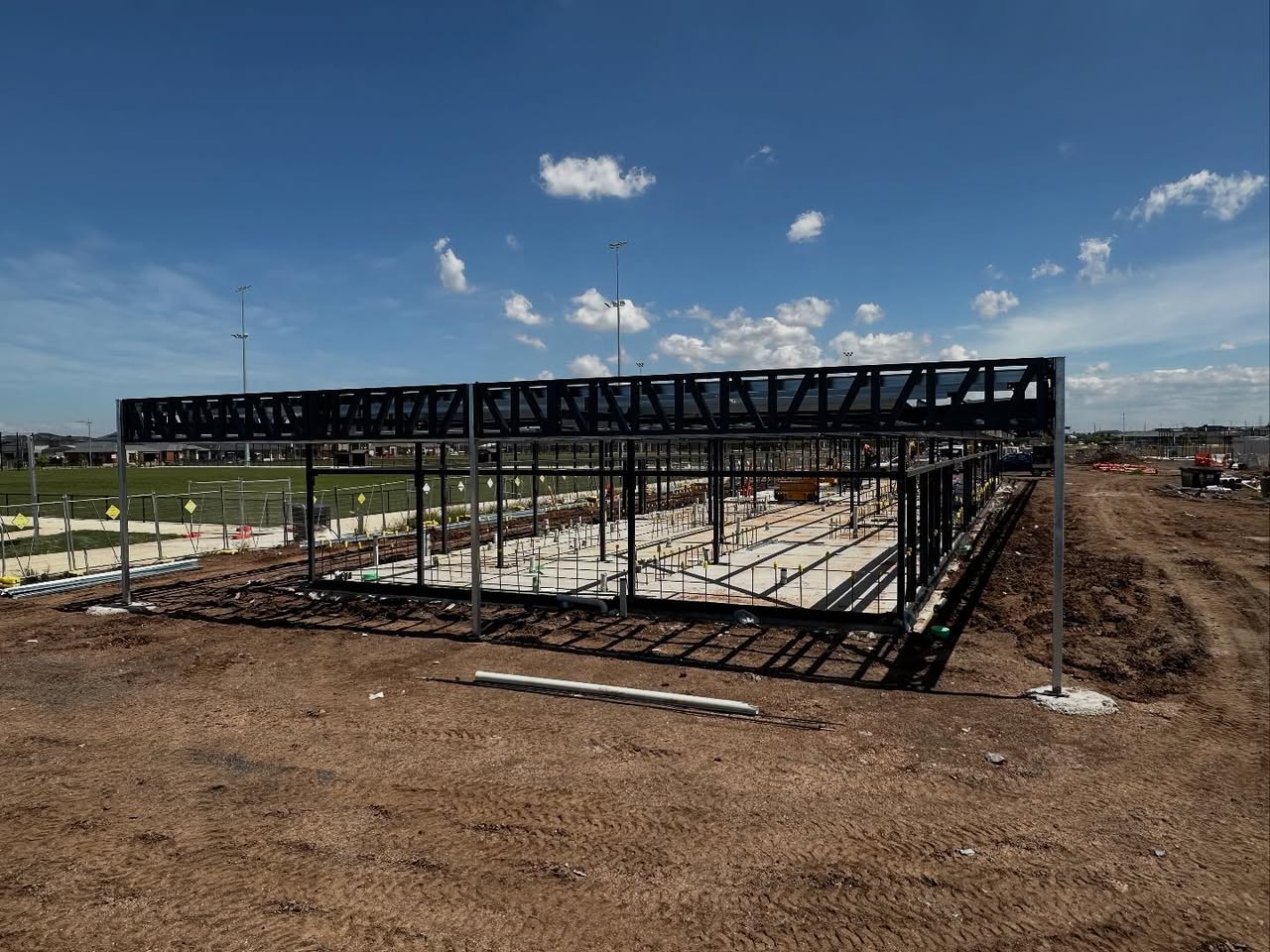 Structural steel frame against blue sky